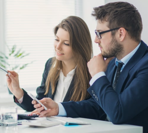 two Orlando IT Consulting staff discussing a project